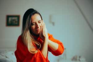 Unhappy woman with TMJ pain needing relief in McLean, VA