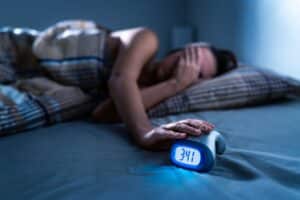 Person struggling to sleep because of sleep apnea in McLean, VA